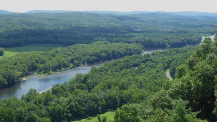 Looking down on the Delaware below Milford from the Tristate overlook (PA, NJ, NY). There is a paddling group on a sandbar in the lower left.